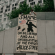 Demonstrators denouncing systemic racism in law enforcement hang a banner criticizing New York City Mayor Bill de Blasio in the borough of Brooklyn minutes before a citywide curfew went into effect on June 4, 2020 in New York City.